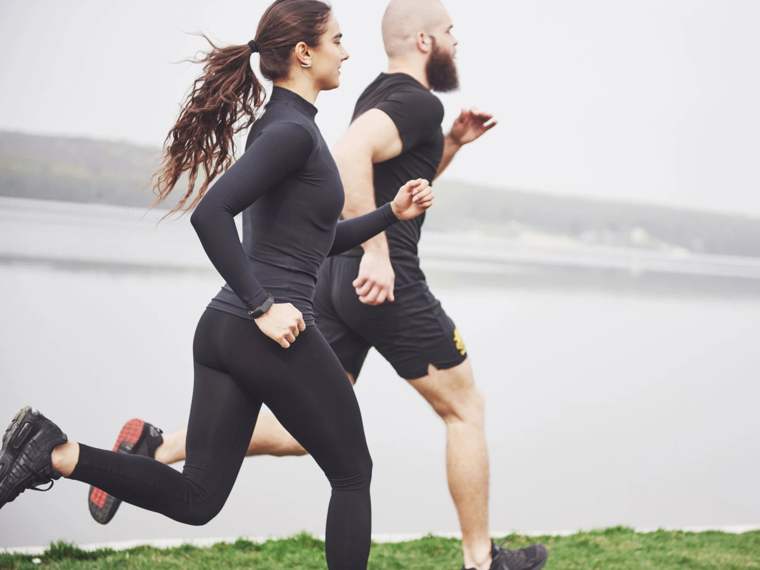https://images.panomnom.com/upload/v1656658440/ST%20BLOGS/Jogging%20Benefits/couple-jogging-running-outdoors-park-near-water-young-bearded-man-woman-exercising-together-morning_s1a6dt.jpg?dpr=2.625&bv=2&height=450&webp=true